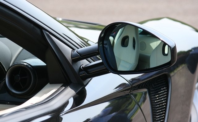Using a plastic trim tool prevents scratching to the paint and body surface.