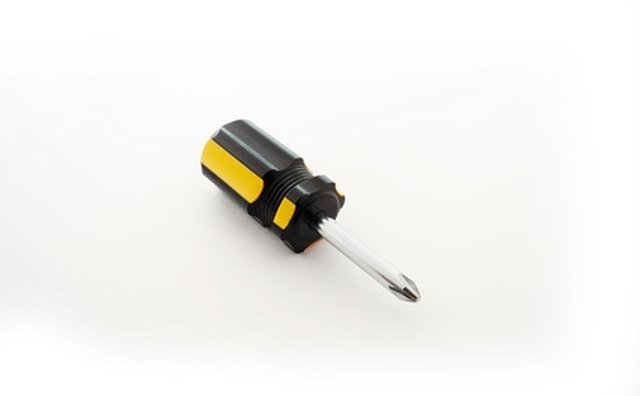 Do not try to remove the fastener buttons with the screwdriver; they will stay with the plastic fasteners.