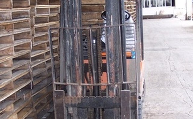Forklifts are used for stacking pallets in warehouse operations.