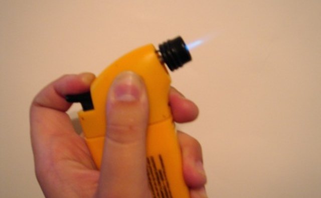 Use a mini torch around the bleeder screw