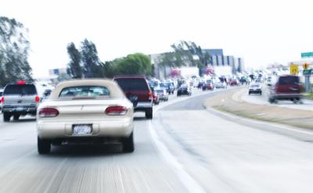 Rear view of car driving away