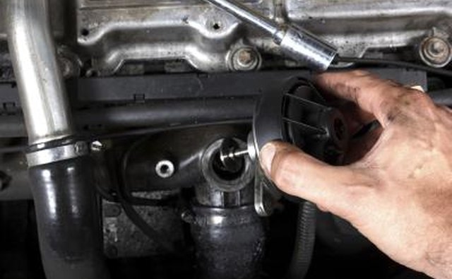 Mechanic inspecting a diesel engine