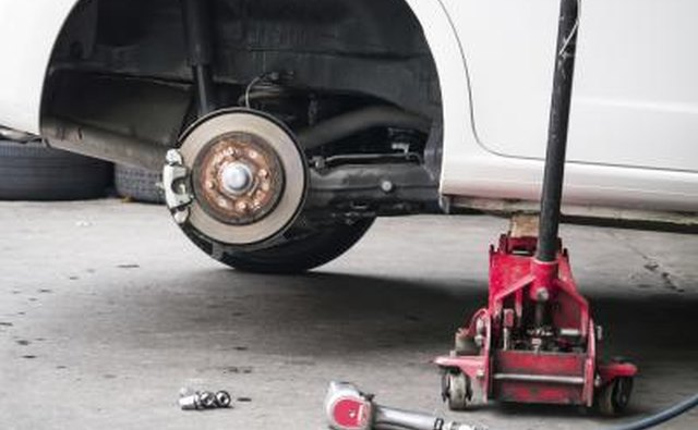 Workers use hydraulic jacks to elevate extremely heavy objects.