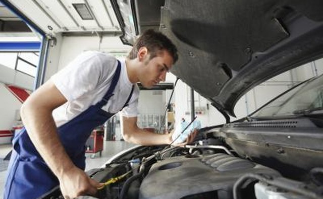 Mechanic looking at car