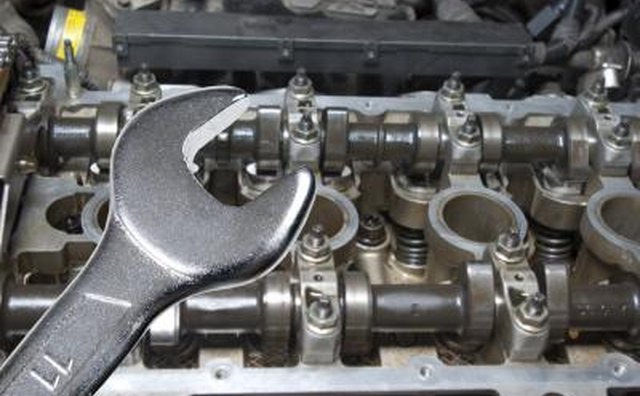 Remove the valve covers to inspect for problems.
