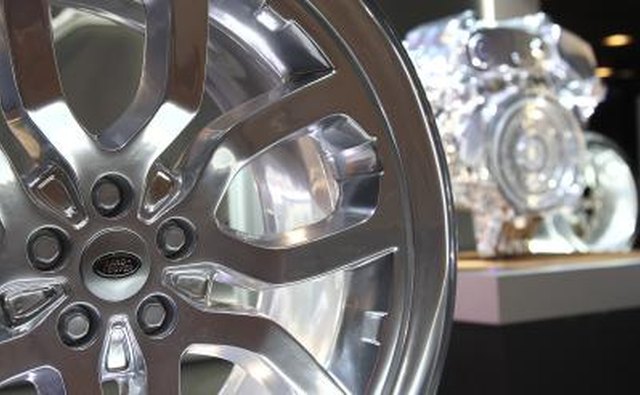 Range Rover rim and engine on display