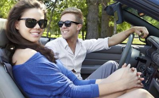 Couple in convertible car