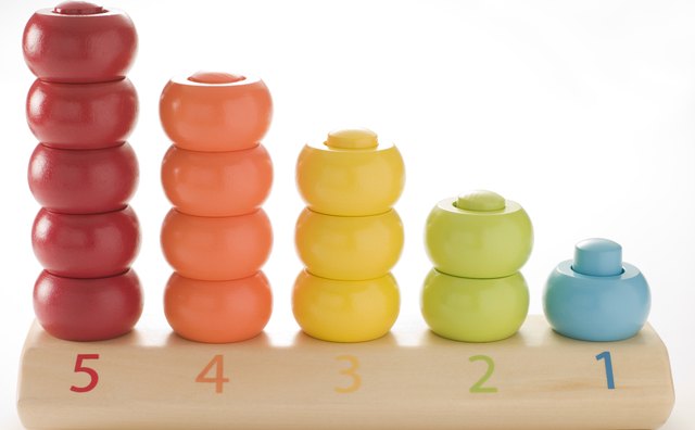 Children often use colorful manipulatives when learning to count groups of objects.