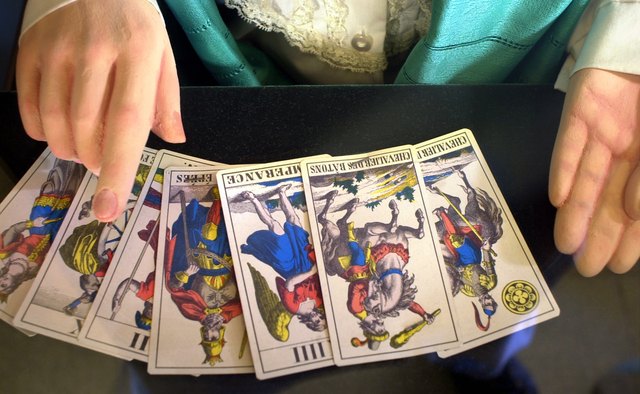 Wiccans may read tarot or practice other forms of magical divination.