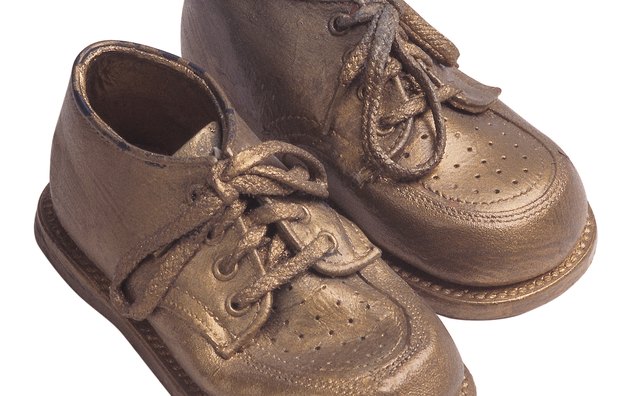 Bronzed shoes can be displayed on a dresser, shelf or desk.