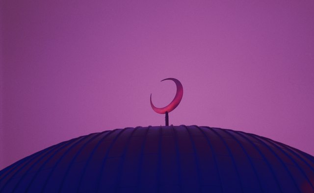 The Islamic crescent symbol often appears on mosques.