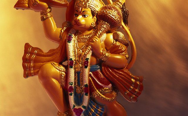 Vishnu's four hands hold objects representing the flow of life and the universe.
