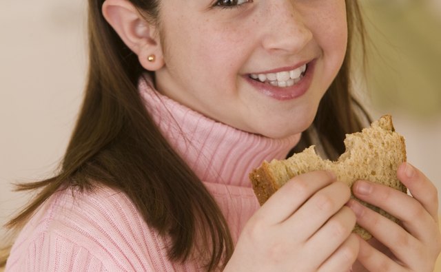 Purchase whole-wheat sandwich bread to satisfy daily whole-grain needs.