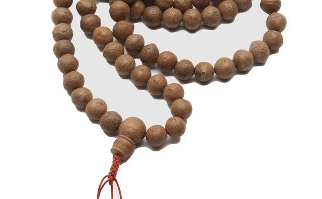 Mala beads are used to create blessings.