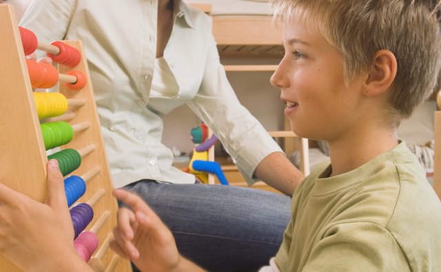 Use beads or blocks to demonstrate the associative property to children.