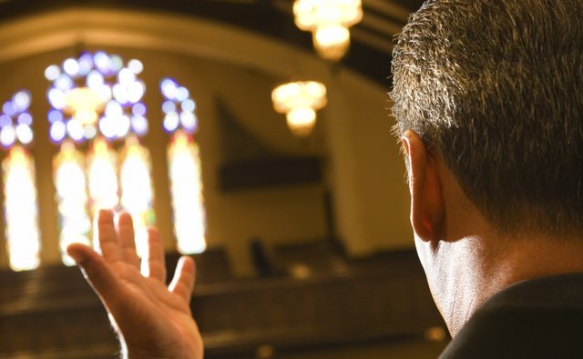Black vestments represent tradition and solemnity.