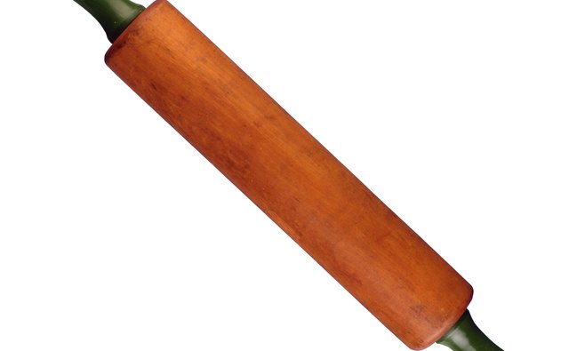 Use a rolling pin to smooth the puff pastry sheet.