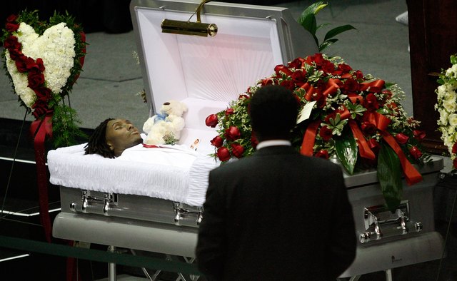 Embalming prepares a body for viewing and burial by delaying decomposition.