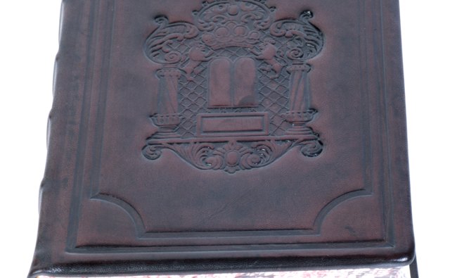Keep a soft toothbrush dry when sweeping out embossed book covers.