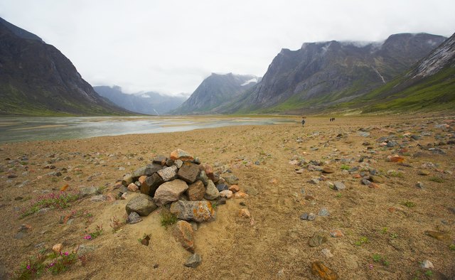 A cairn marks a gravesite.