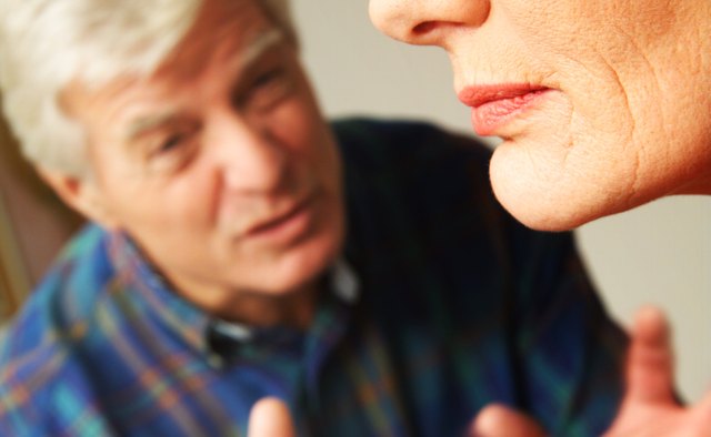 A man talks to his angry wife.