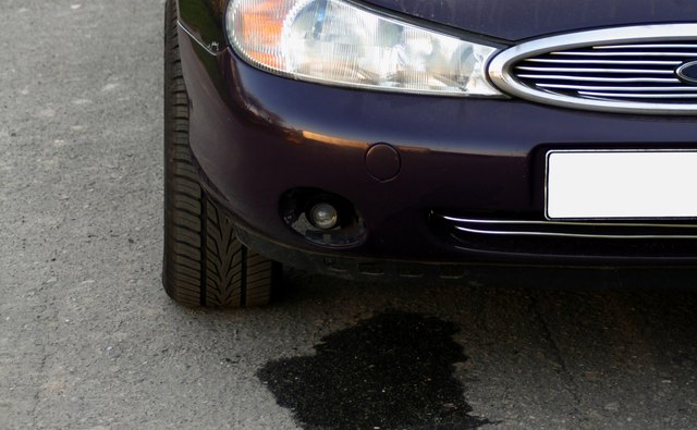 A puddle under the car could indicate a coolant leak.