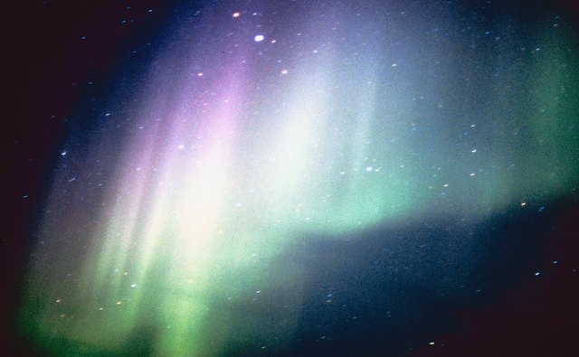 Auroras are caused by sunspots, which release plasma that collides with the atmosphere.