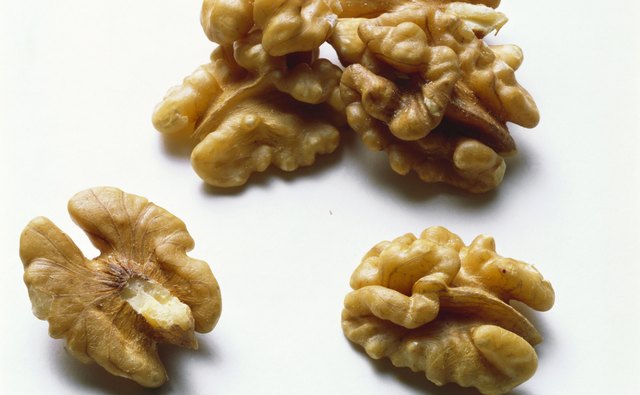 Brown the pecans or walnuts in a buttered saucepan.
