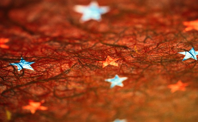 Choose tissue paper in fall colors to make a hibernation collage.