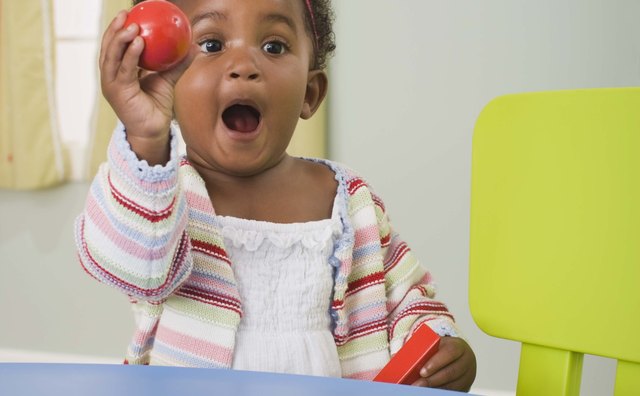 Toddlers will delight in discovering differently shaped and textured objects hidden in a cloth container.