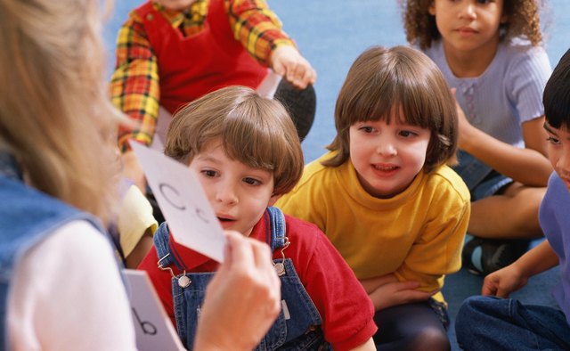 Letter names and sounds are essential skills to focus on in the bottom-up approach to reading.