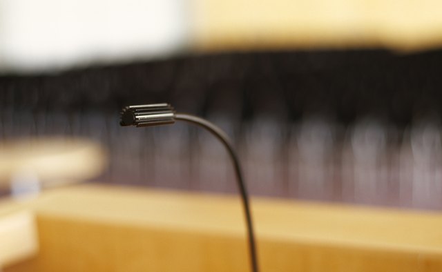 Ask the recipient to come forward and join you at the podium.