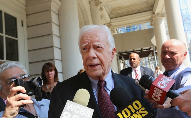 Jimmy Carter speaks to the media.