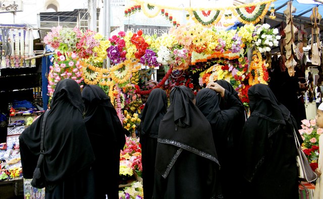 A group of women dressed in niqab.