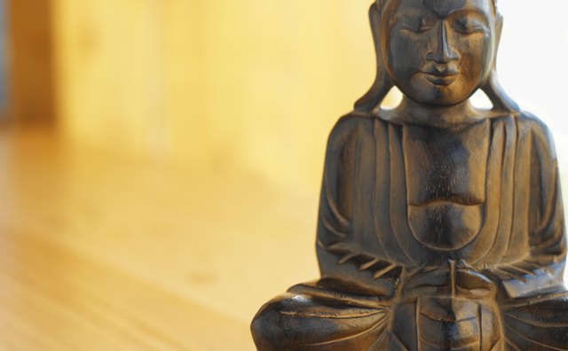 A statue often depicts a seated Buddha.