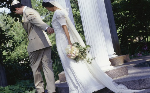 In the Jewish tradition, the groom covers the bride's face before the ceremony.