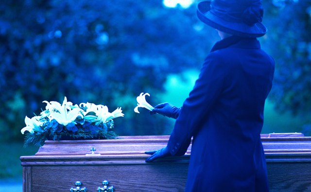 A mourner at a funeral.