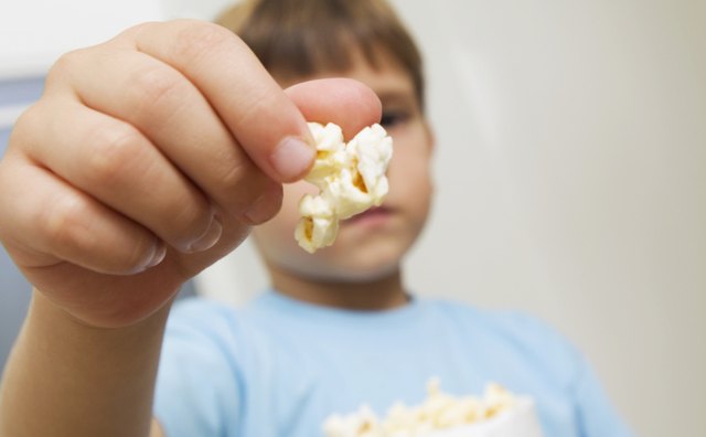 Save hard foods, like popcorn, for when your child is over age 4.