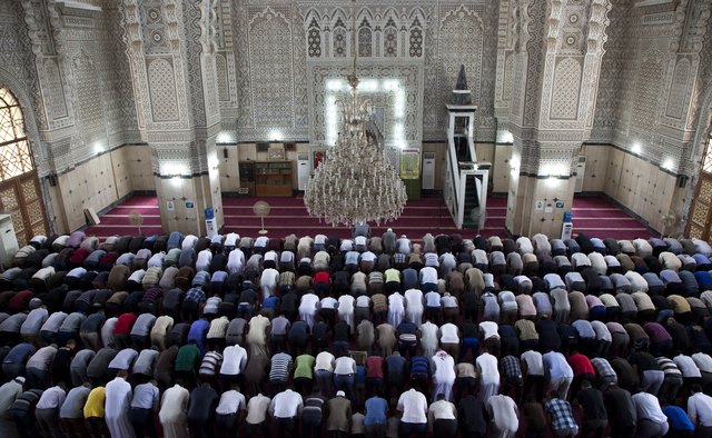Men pray in a Baghdad mosque