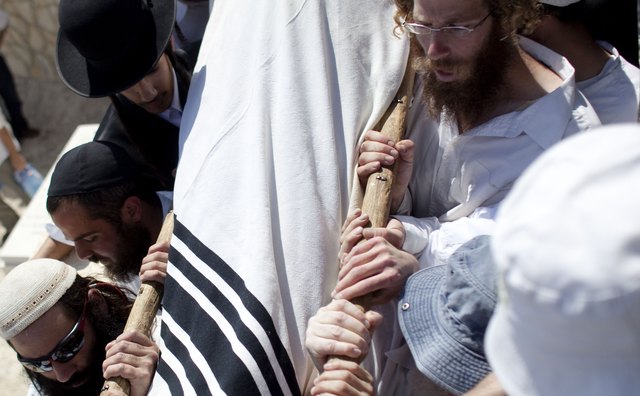 Mourners in Israel carry a body shrouded rather than placed in a casket.