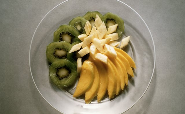 Mix kiwi and mango for a tropical salad.