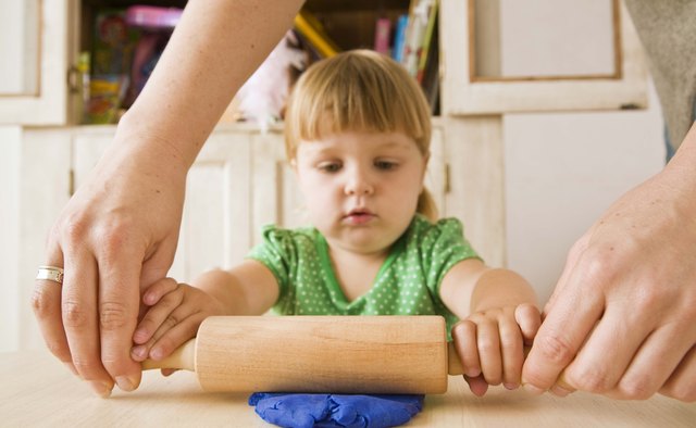 Making play dough teaches children how to follow a simple recipe.