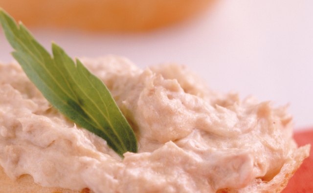 Toasted crostini hold up well to thick savory spreads.