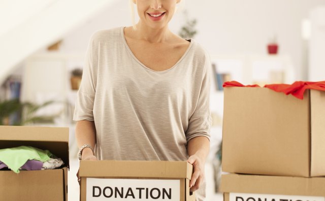A woman collects donations for disaster relief.