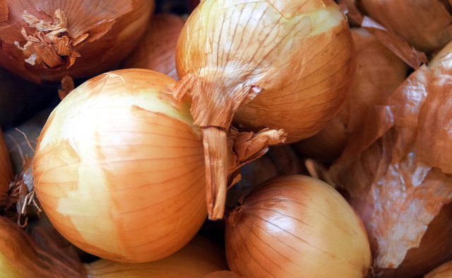 Spread the caramelized onions over the pastry sheet.