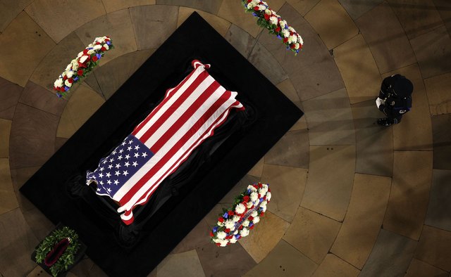 Flags can replace casket veils during military funerals.