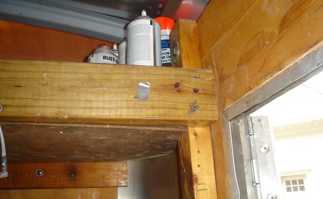 Two by four lumber makes economical shelf supports