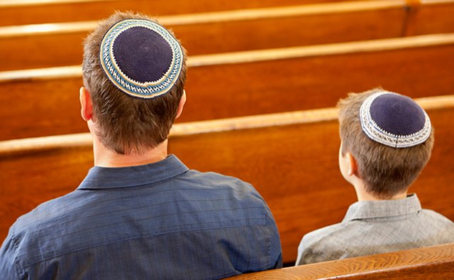 Men wear a skullcap to cover their heads.