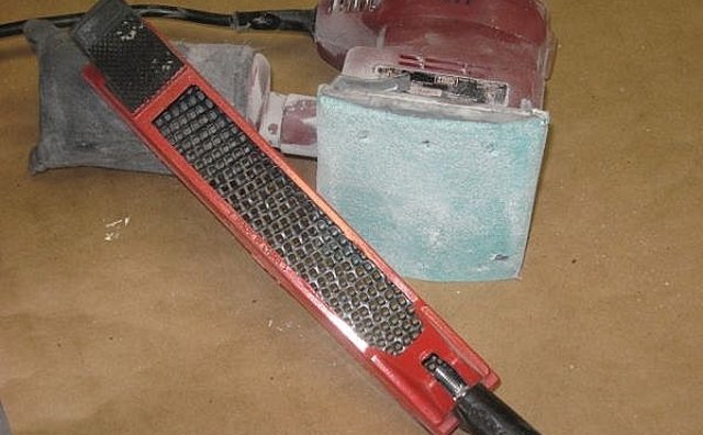 60 grit paper on power sander and bondo scraper tool for excess bondo