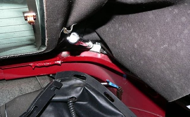 Removing back screws that hold the top